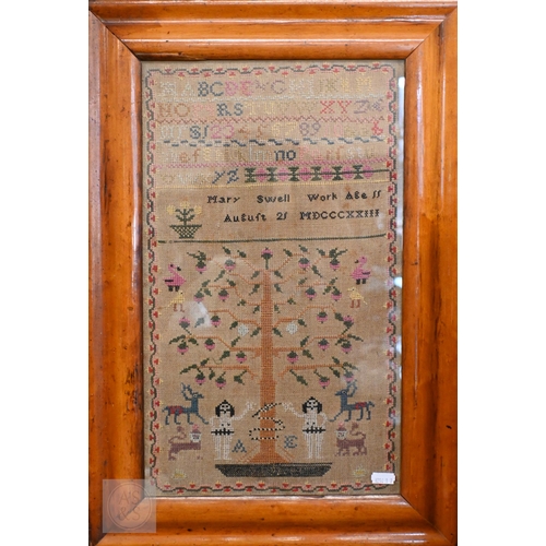 561 - A George IV needlework sampler worked with alphabets and numbers above Adam & Eve with the snake... 
