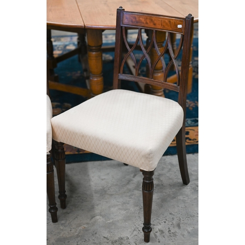 578 - A set of four Edwardian mahognay lattice back dining chairs, overstuffed with pale pink diamond patt... 