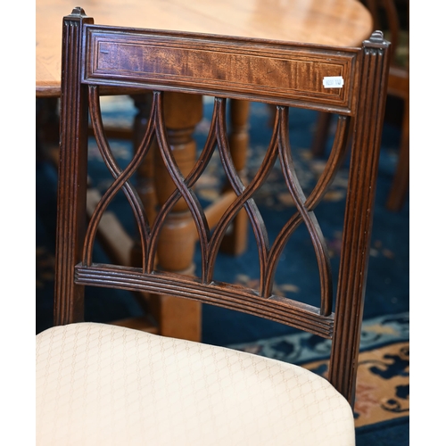 578 - A set of four Edwardian mahognay lattice back dining chairs, overstuffed with pale pink diamond patt... 