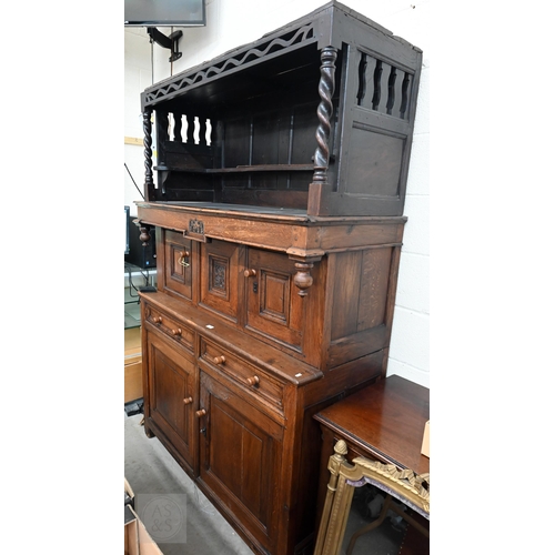 583 - An 18th century and later oak tridarn with two drawers and panelled cupboard doors, 134 x 60 x 210 c... 