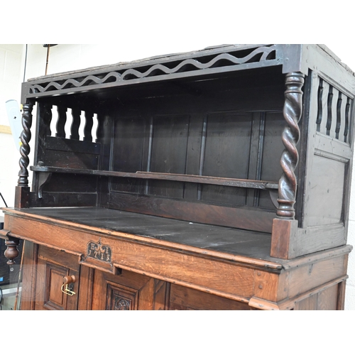 583 - An 18th century and later oak tridarn with two drawers and panelled cupboard doors, 134 x 60 x 210 c... 