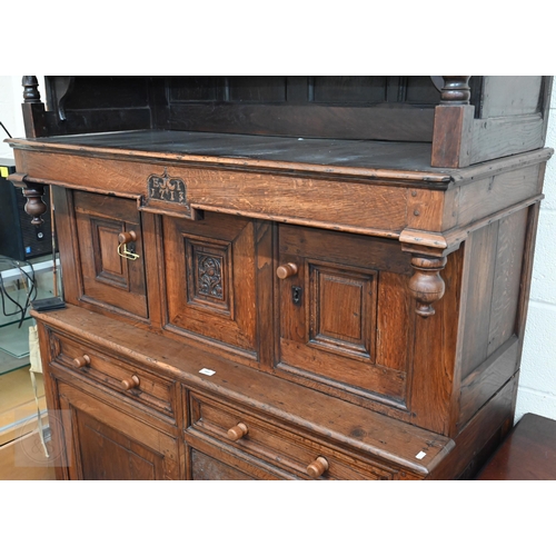 583 - An 18th century and later oak tridarn with two drawers and panelled cupboard doors, 134 x 60 x 210 c... 