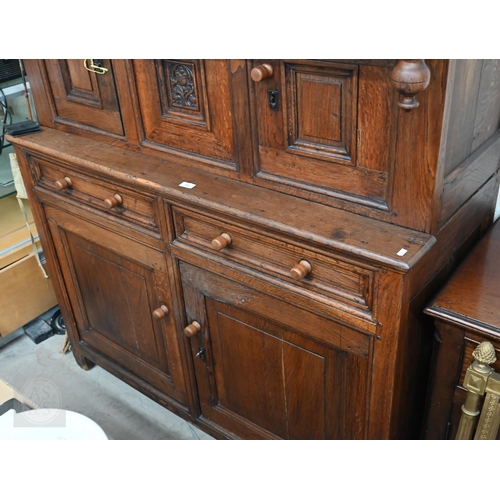 583 - An 18th century and later oak tridarn with two drawers and panelled cupboard doors, 134 x 60 x 210 c... 