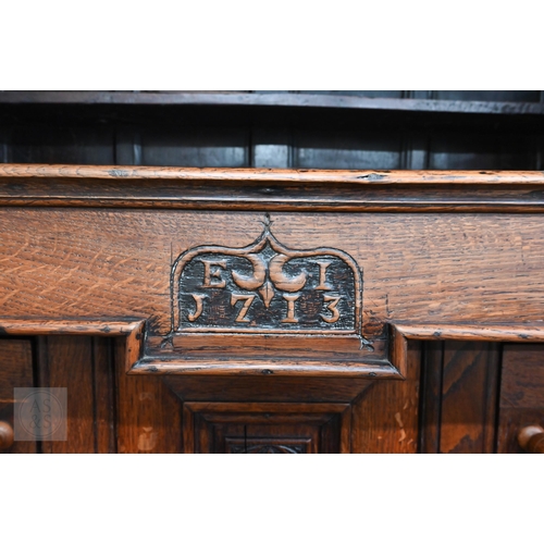 583 - An 18th century and later oak tridarn with two drawers and panelled cupboard doors, 134 x 60 x 210 c... 