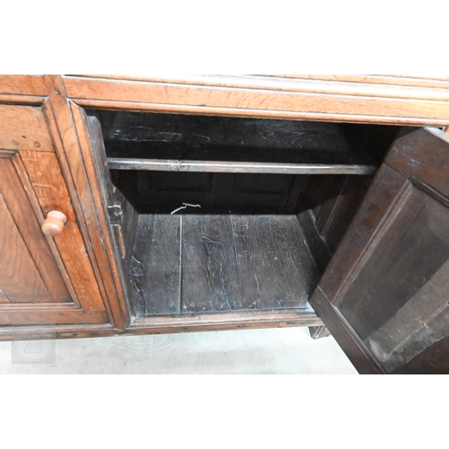 583 - An 18th century and later oak tridarn with two drawers and panelled cupboard doors, 134 x 60 x 210 c... 