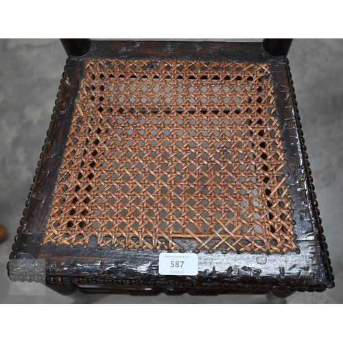 587 - A Victorian stained beech cane seated correction chair on turned legs