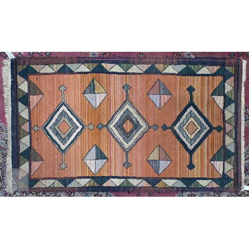 601 - A Turkish Milas cream ground rug with floral diamond medallions and yellow border, 182 x 121 cm to/w... 