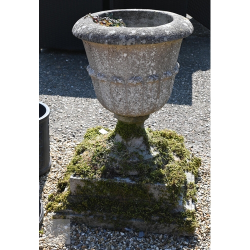 8 - A large weathered reconstituted stone garden tub planter raised on a stepped square plinth base, 73 ... 