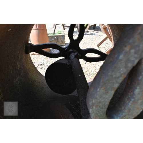 9 - A weathered vintage cast iron garden roller