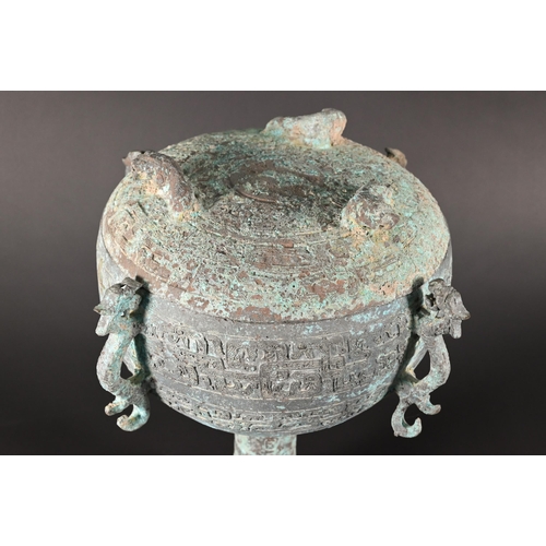 371 - A Chinese bronze ritual food vessel and cover in the Warring States style, Dou, the bowl has four ca... 