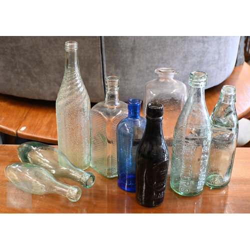 384 - Various antique and vintage glass bottles, including cods, Hamilton torpedoes, square spirit bottles... 
