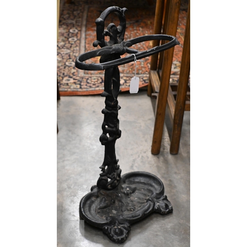 393 - A Victorian cast iron boot-scraper, to/w a stick-tand and a fireside companion set (3)