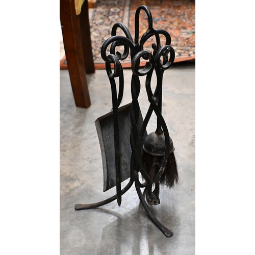 393 - A Victorian cast iron boot-scraper, to/w a stick-tand and a fireside companion set (3)