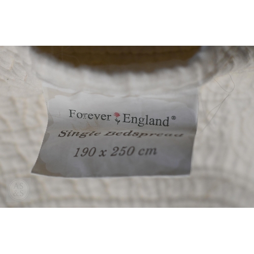 572 - ##Two vintage cream feather-filled eiderdowns/counterpanes, a white cotton embroidered bed cover, a ... 
