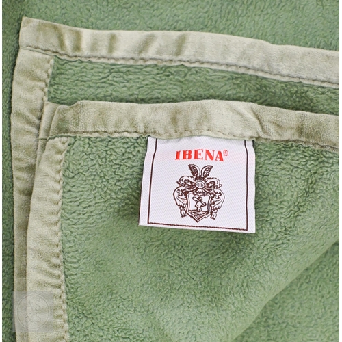 573 - A selection of pink and cream woollen cellular and solid weave blankets, some with satin edging, var... 