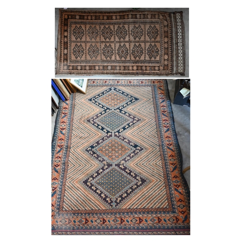 589 - An antique Perisian rug with geometric design, to/w an Afghan double saddle bag (2)