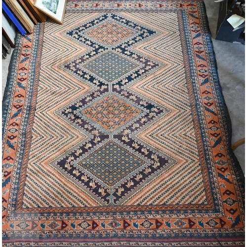 589 - An antique Perisian rug with geometric design, to/w an Afghan double saddle bag (2)