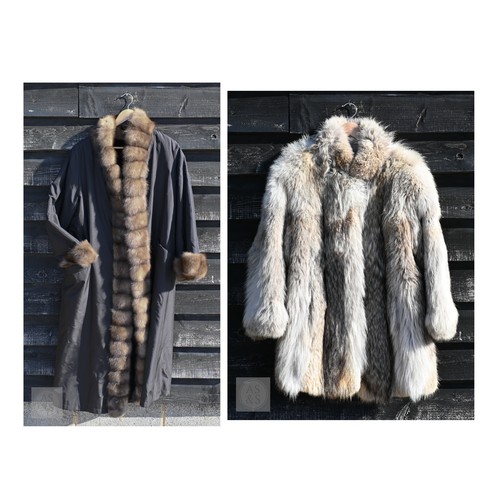 574 - A fur-timmed reversible long coat in black to/w a mid length fox fur jacket (2)