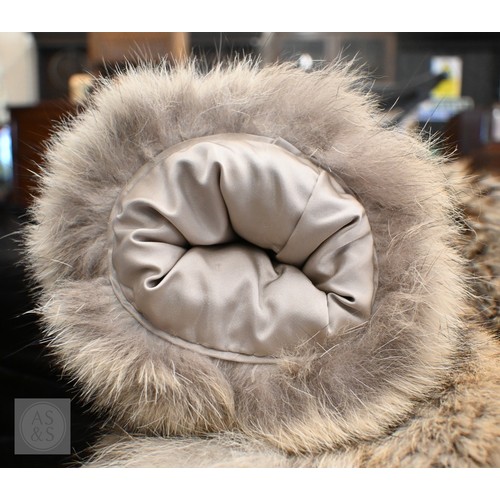 574 - A fur-timmed reversible long coat in black to/w a mid length fox fur jacket (2)