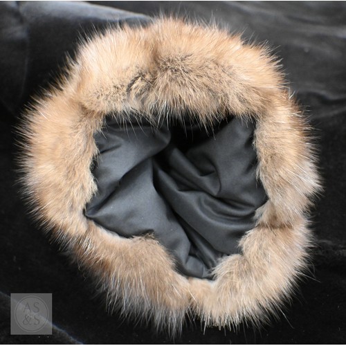 574 - A fur-timmed reversible long coat in black to/w a mid length fox fur jacket (2)