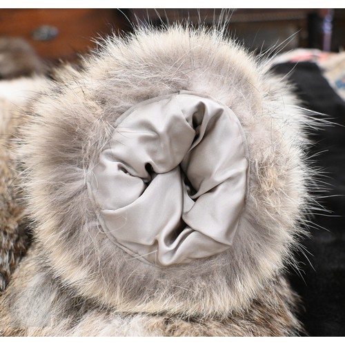 574 - A fur-timmed reversible long coat in black to/w a mid length fox fur jacket (2)