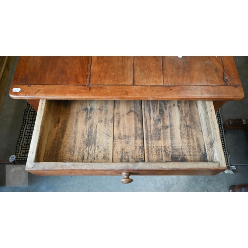 147 - A small French cherrywood dining table with cleated three-plank top and drawer to one end, raised on... 