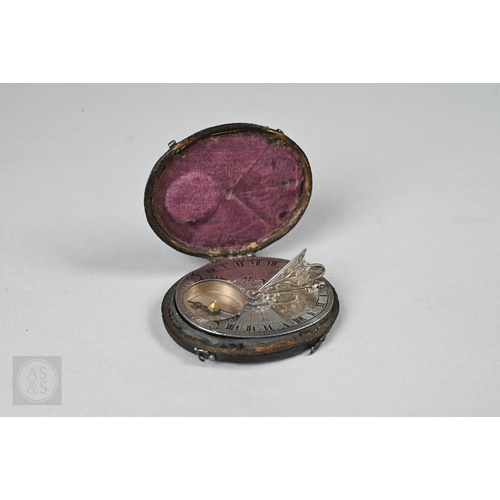 WITHDRAWN Roch Blondeau, Paris, an early 18th century silver oval Butterfield type pocket compass, with Roman numeral segmented dial and floral chased hinged gnomon, the compass dial with single centre line and 'N' with blue steel pointer, the verso signed, 45 mm long, within a black fish-skin fitted case - cased