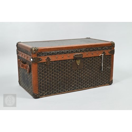 An good antique Goyard leather bound travel trunk, the interior with two compartmented trays for shoes, the locks and fittings stamped, branded to the underside wooden runners Malles Goyard, 233 Rue St Honore, Paris, 63 cm x 34 cm x 32 cm h