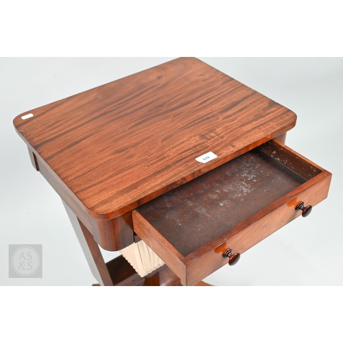 50 - A Victorian mahogany work table, the rectangular top with frieze drawer over a tapering pleated silk... 