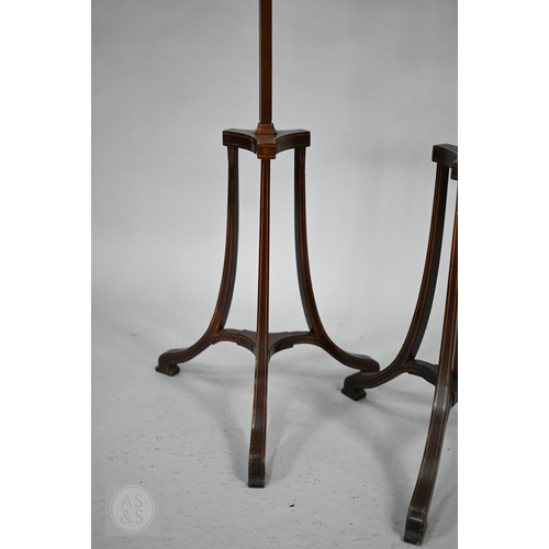 52 - A close matched pair of Sheraton design line inlaid tri-form base pole screens, the rise and fall gl... 
