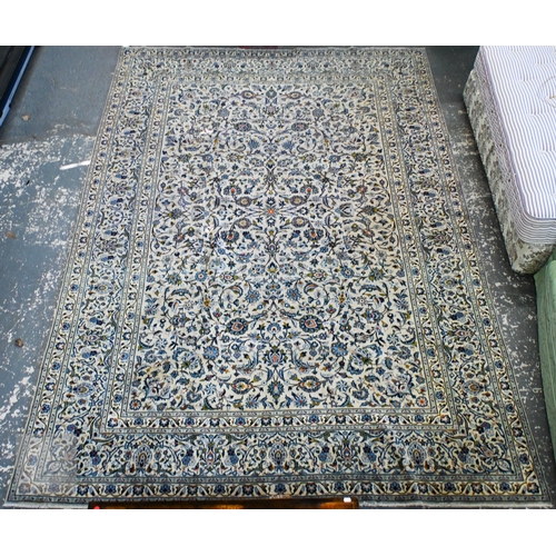 161 - A large Persian Kashan carpet, traditional floral design on cream ground, signed border, 416 x 285 c...