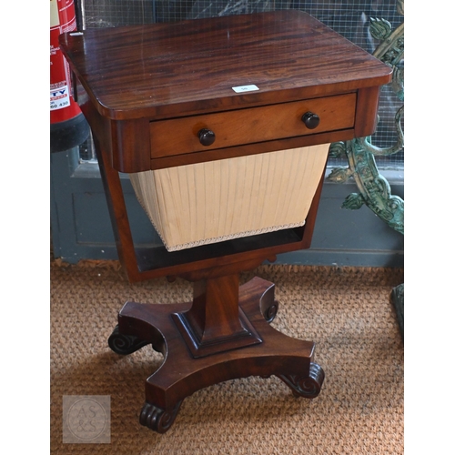 50 - A Victorian mahogany work table, the rectangular top with frieze drawer over a tapering pleated silk... 