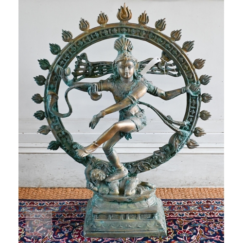 51 - A verdigris patinated heavy brass cast brass Indian dancing figure, 85 cm h