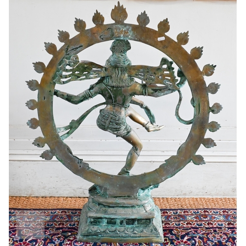 51 - A verdigris patinated heavy brass cast brass Indian dancing figure, 85 cm h