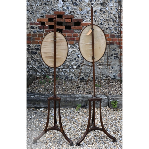 52 - A close matched pair of Sheraton design line inlaid tri-form base pole screens, the rise and fall gl... 