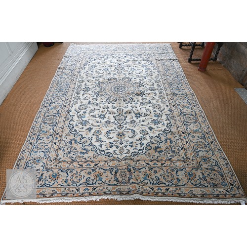 Central Persian Kashan carpet with blue and orange medallion arabesque design within rosette borders, 313 x 202 cm