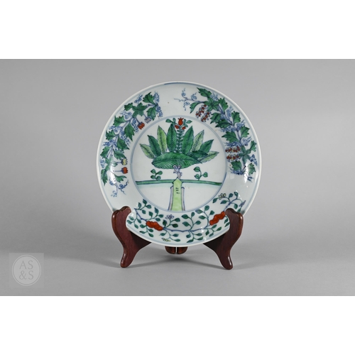 311 - A Chinese Doucai pomegranate dish, the stylised central tree surrounded by grape, peach and pomegran... 