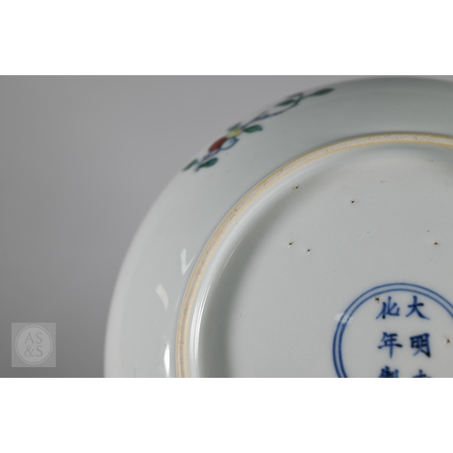 311 - A Chinese Doucai pomegranate dish, the stylised central tree surrounded by grape, peach and pomegran... 