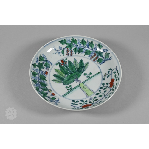 311 - A Chinese Doucai pomegranate dish, the stylised central tree surrounded by grape, peach and pomegran... 