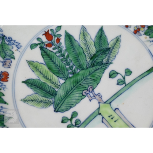 311 - A Chinese Doucai pomegranate dish, the stylised central tree surrounded by grape, peach and pomegran... 