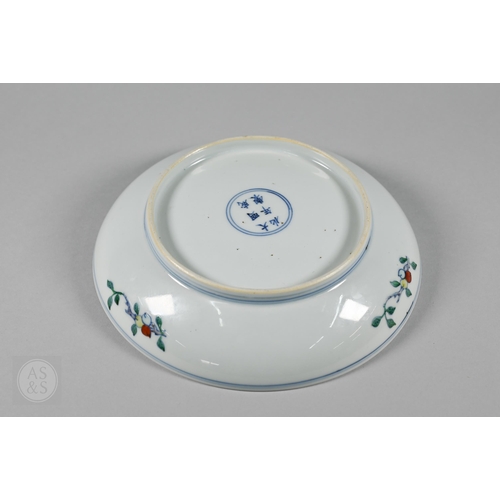 311 - A Chinese Doucai pomegranate dish, the stylised central tree surrounded by grape, peach and pomegran... 