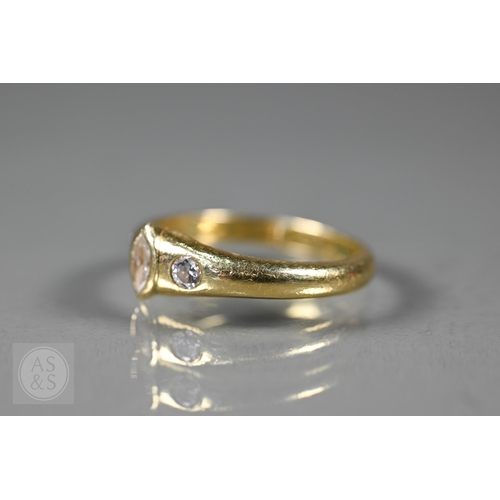 154 - An 18ct yellow gold ring set three bezel set diamonds, one of marquise-shape, flanked by two circula... 