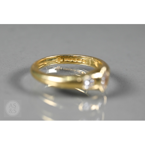 154 - An 18ct yellow gold ring set three bezel set diamonds, one of marquise-shape, flanked by two circula... 