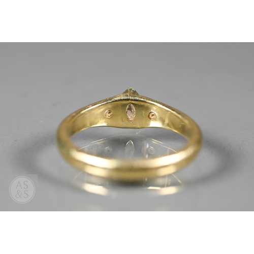 154 - An 18ct yellow gold ring set three bezel set diamonds, one of marquise-shape, flanked by two circula... 