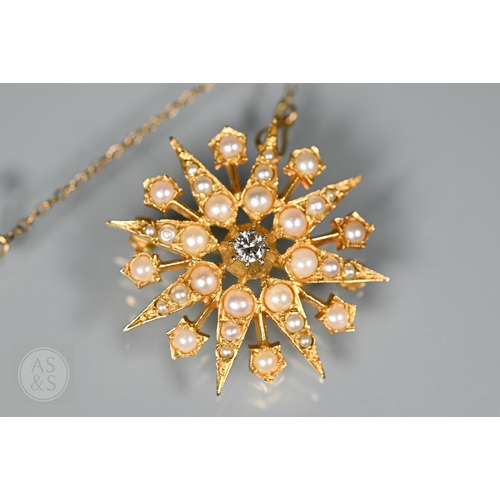 183 - A Victorian 9ct yellow gold starburst brooch set overall with seed pearls and a central old cut diam... 