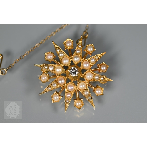 183 - A Victorian 9ct yellow gold starburst brooch set overall with seed pearls and a central old cut diam... 