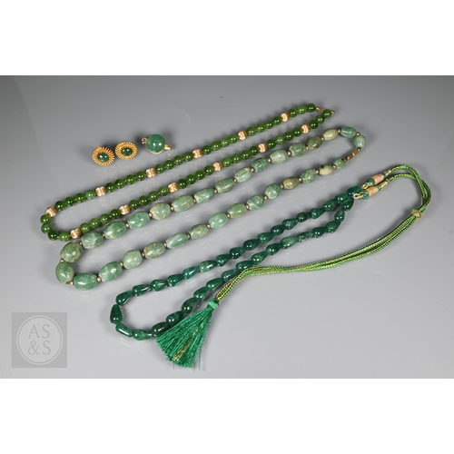 185 - A green jade bead necklace with yellow metal beads and clasp, stamped 14k; another green jade neckla... 