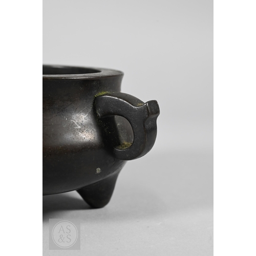 310 - A 17th/18th century Chinese bronze censer (incense burner) and original stand, the censer with compr... 