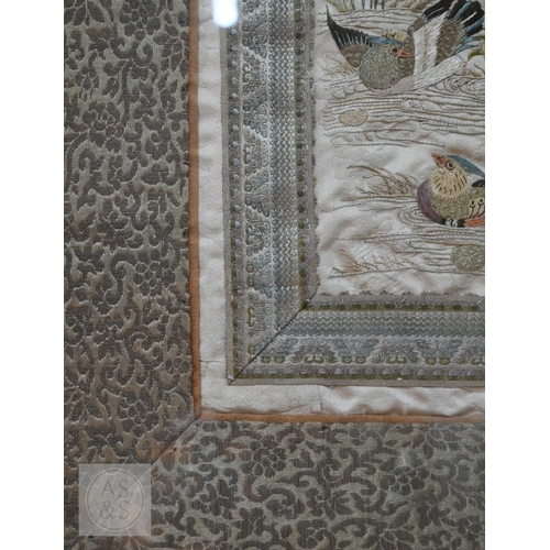 339 - Two framed late 19th or early 20th century Chinese silk embroidered panels, the first possibly a dow... 