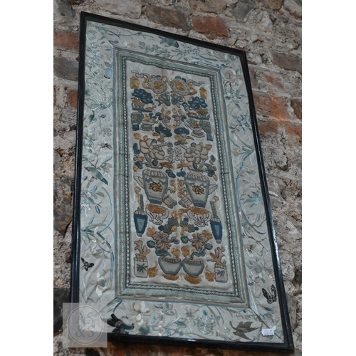 339 - Two framed late 19th or early 20th century Chinese silk embroidered panels, the first possibly a dow... 